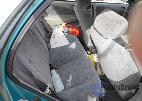 1999 Toyota Corolla Le z USA, uszkodzony, nr VIN 2T1BR12E2XC208457